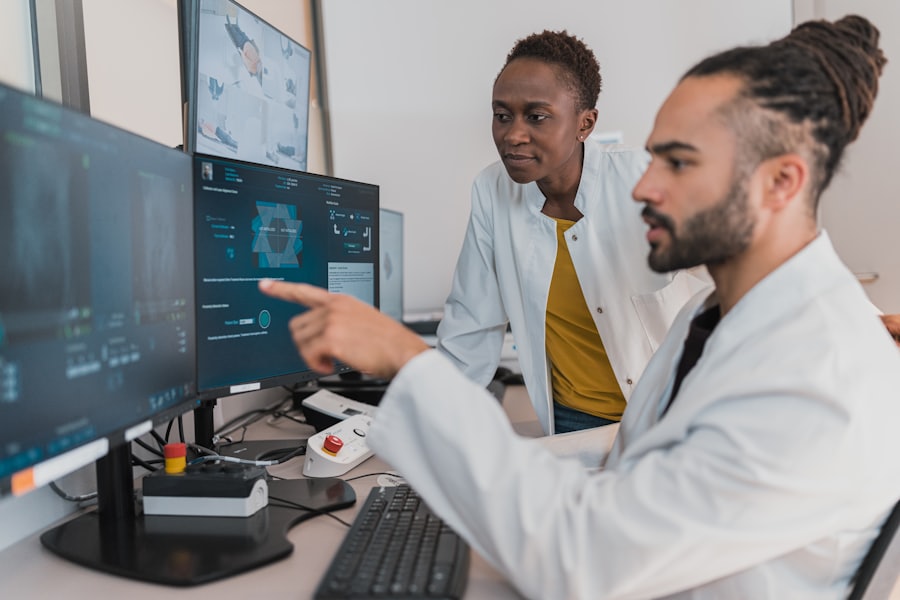 Two clinicians reviewing medical images on monitors