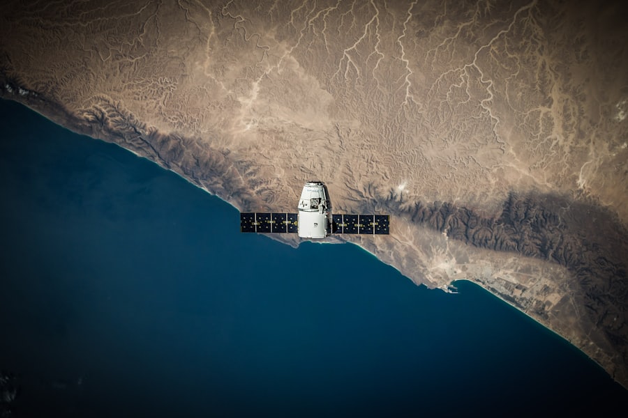 Satellite in orbit above a coastline